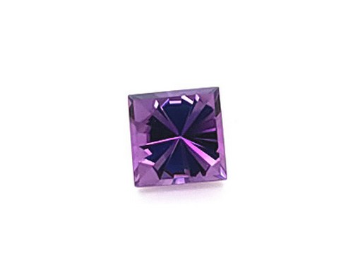 A Square Shaped Violet Gemstone on a White Background