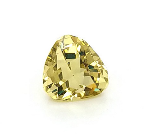 A triangular shape beryl heliodor gem stone